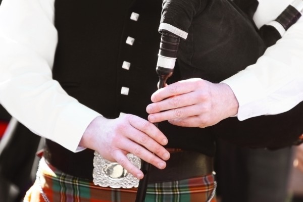 Scottish piper playing the bagpipes