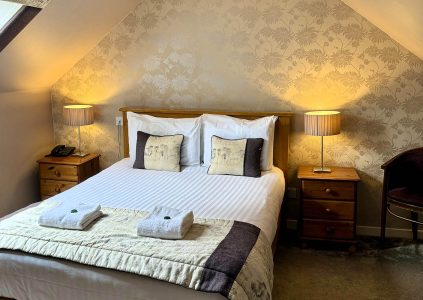 A cosy double bedroom at Glen Clova Hotel