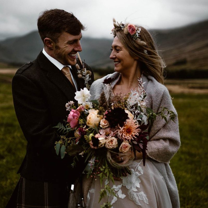 A bride and groom in the Glen of Glen Clova on a moody Scottish day on their wedding day. Photography by Burfly https://burfly.co.uk/