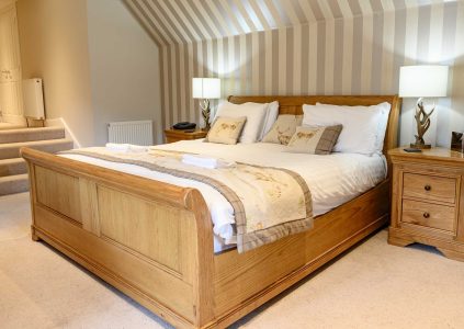 A luxurious double bed in the Glen Clova Hotel