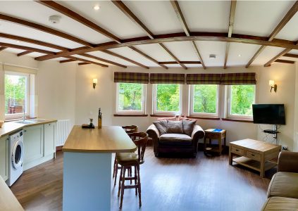 The open plan living area in Old Mill Lodge at Glen Clova Hotel and Lodges in Scotland