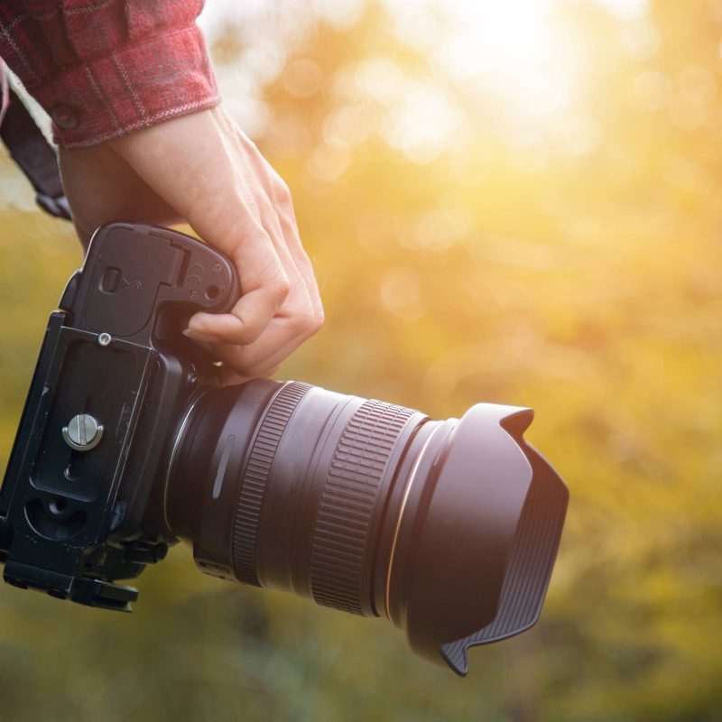 Close up of camera with nature background