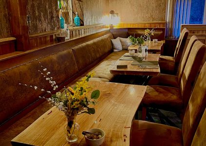 Tables for dining in the cosy Bothy at Glen Clova Hotel and Lodges in Scotland