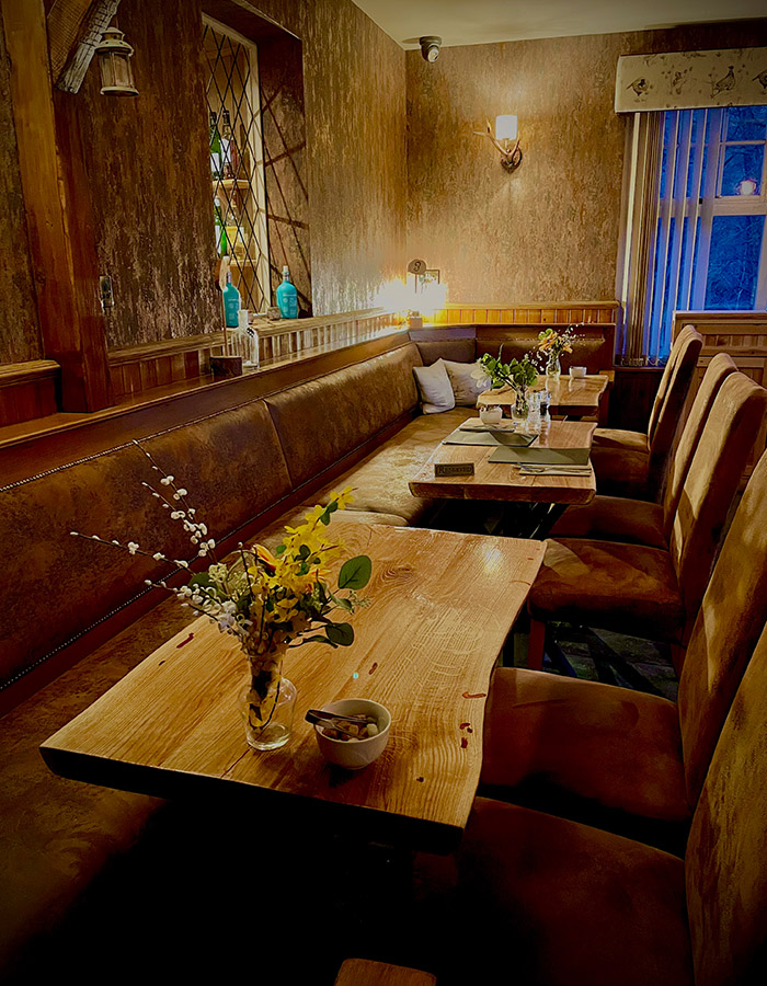 Tables for dining in the cosy Bothy at Glen Clova Hotel and Lodges in Scotland