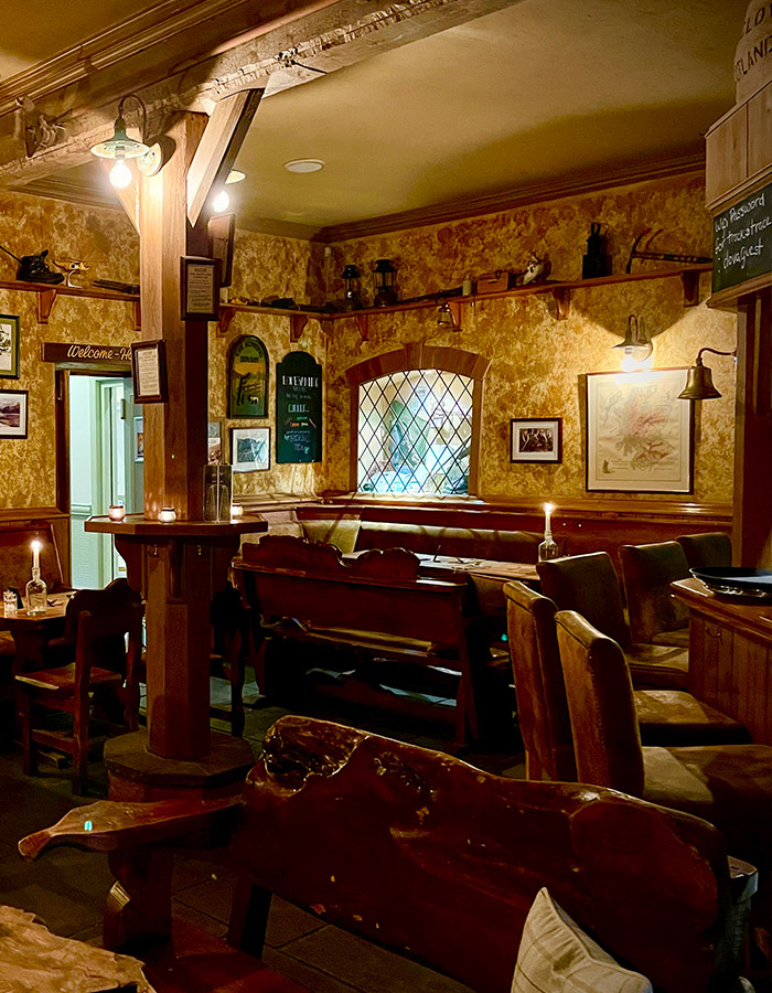 Tables and seating in The Climber's Bar at Glen Clova Hotel and Lodges in Scotland