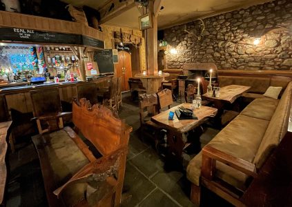 The bar and tables and seating in The Climber's Bar at Glen Clova Hotel and Lodges in Scotland