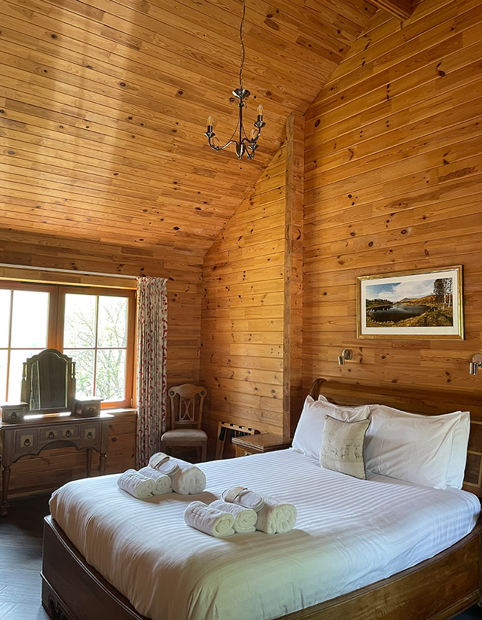 Double bedroom in a Hideaway Lodge at Glen Clova Hotel