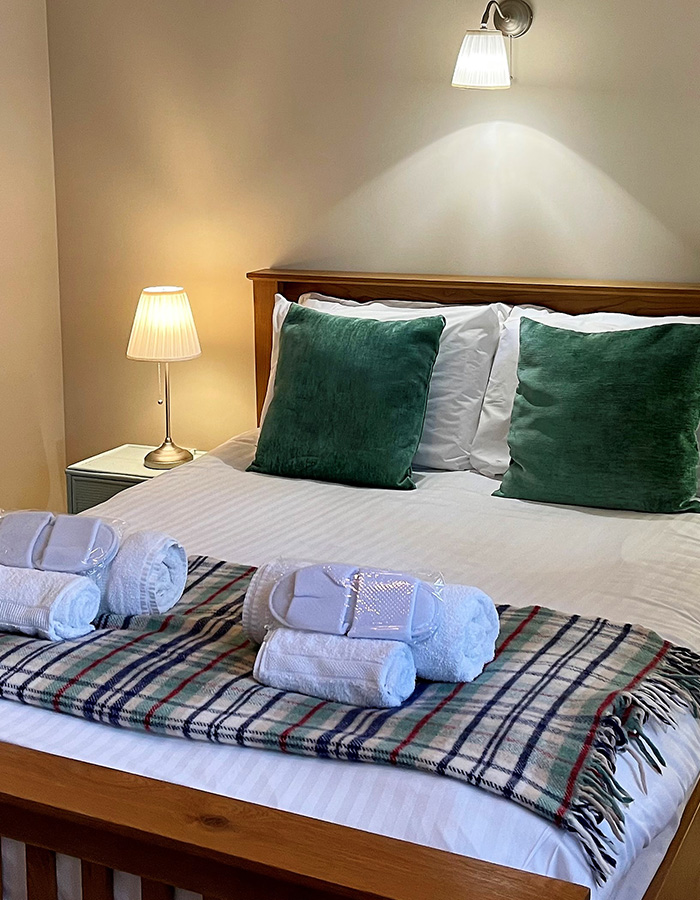 A double bedroom in Brandy Cottage at Glen Clova Hotel