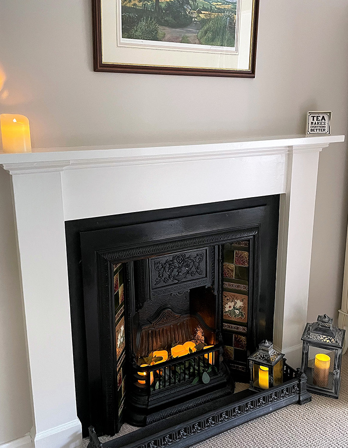 A fireplace in The Old Manse at Glen Clova Hotel