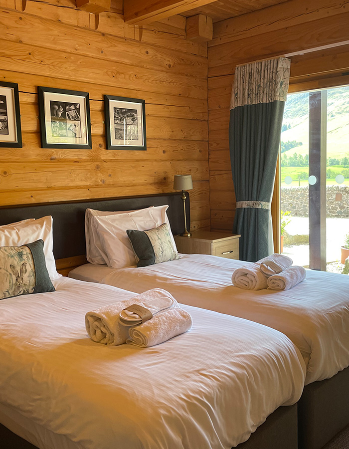 A twin room in a Glen Lodge at Glen Clova Hotel