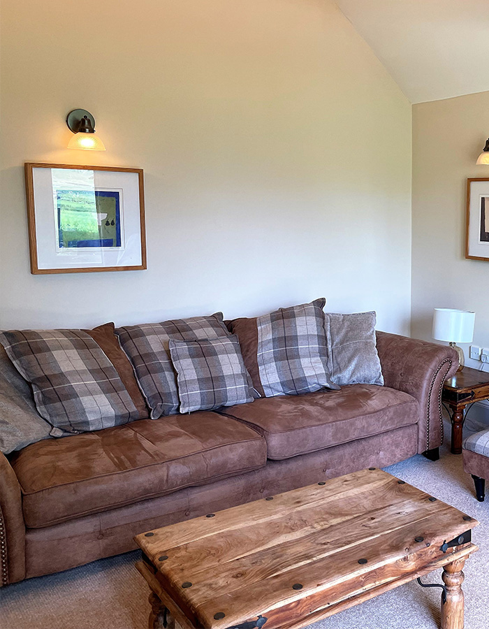 The living room in Brandy Cottage at Glen Clova Hotel