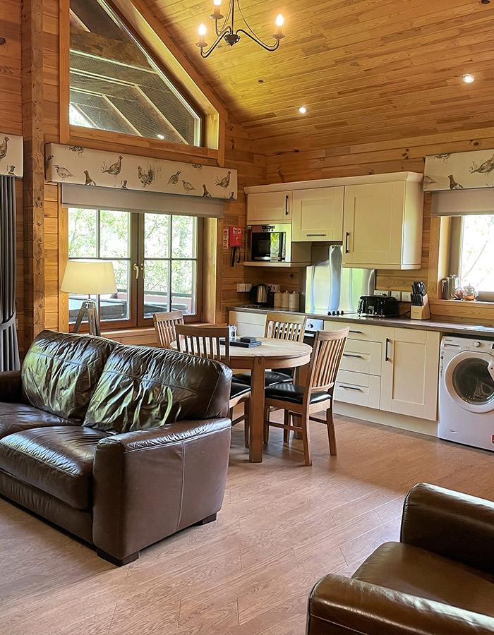 Open plan living area in a Hideaway Lodge at Glen Clova Hotel