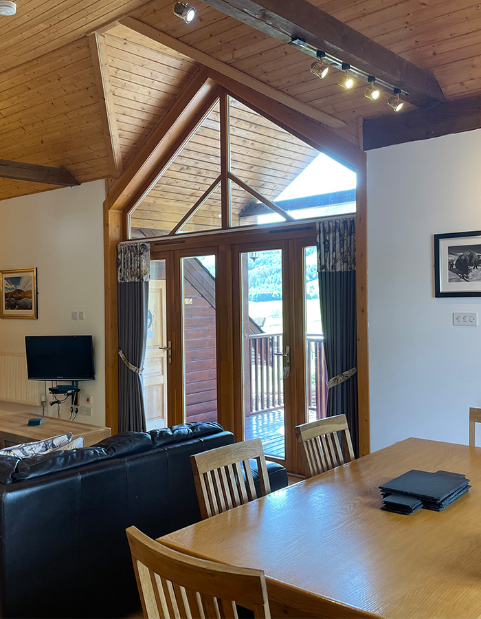 Living and dining area in a Glen Lodge at Glen Clova Hotel