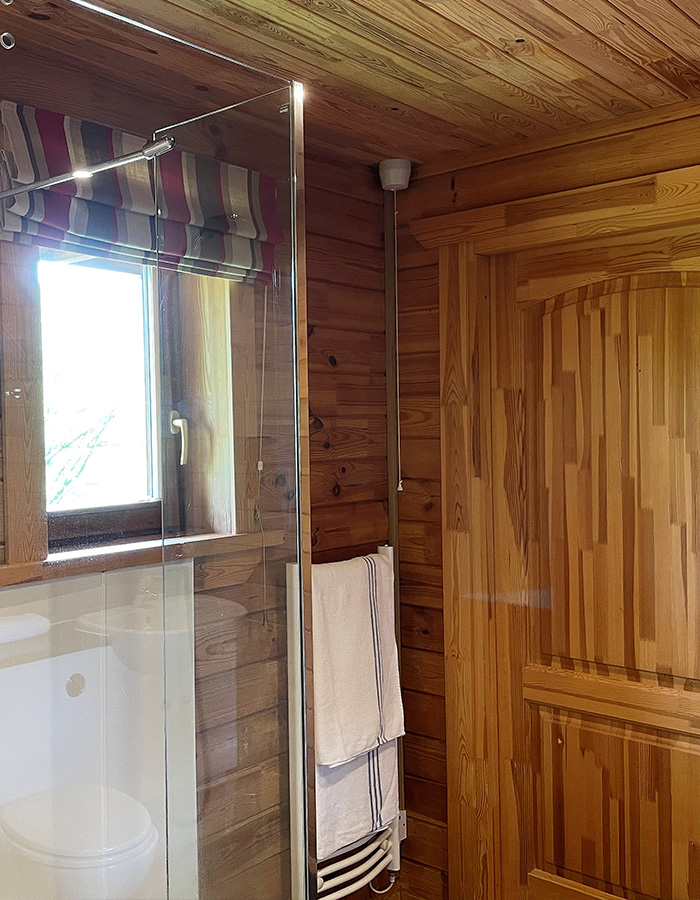 A shower in a Hideaway Lodge at Glen Clova Hotel