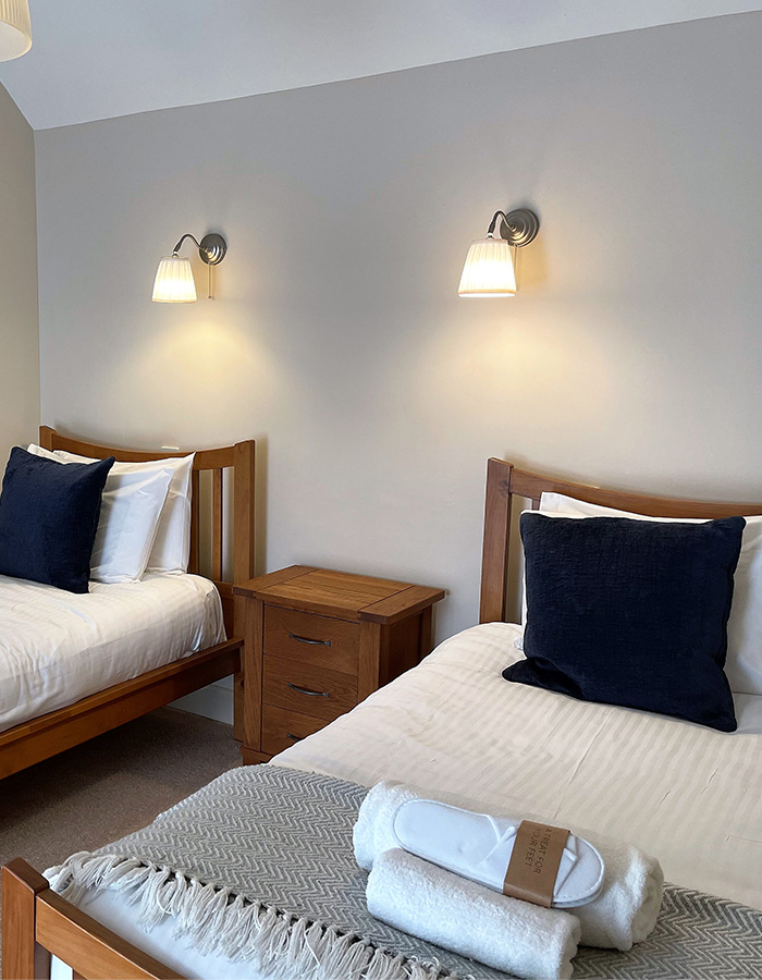 A twin room in Brandy Cottage at Glen Clova Hotel