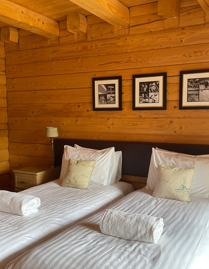 A twin room in a Glen Lodge at Glen Clova Hotel