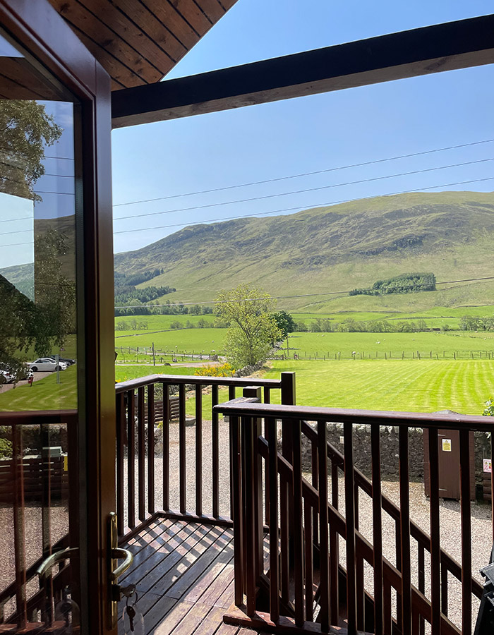 A view from the balcony of a Glen Lodge at Glen Clova Hotel