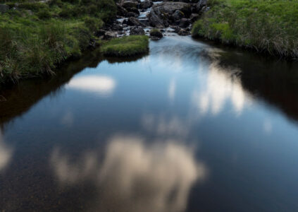 Cloud reflections in the water at Corrie Fee