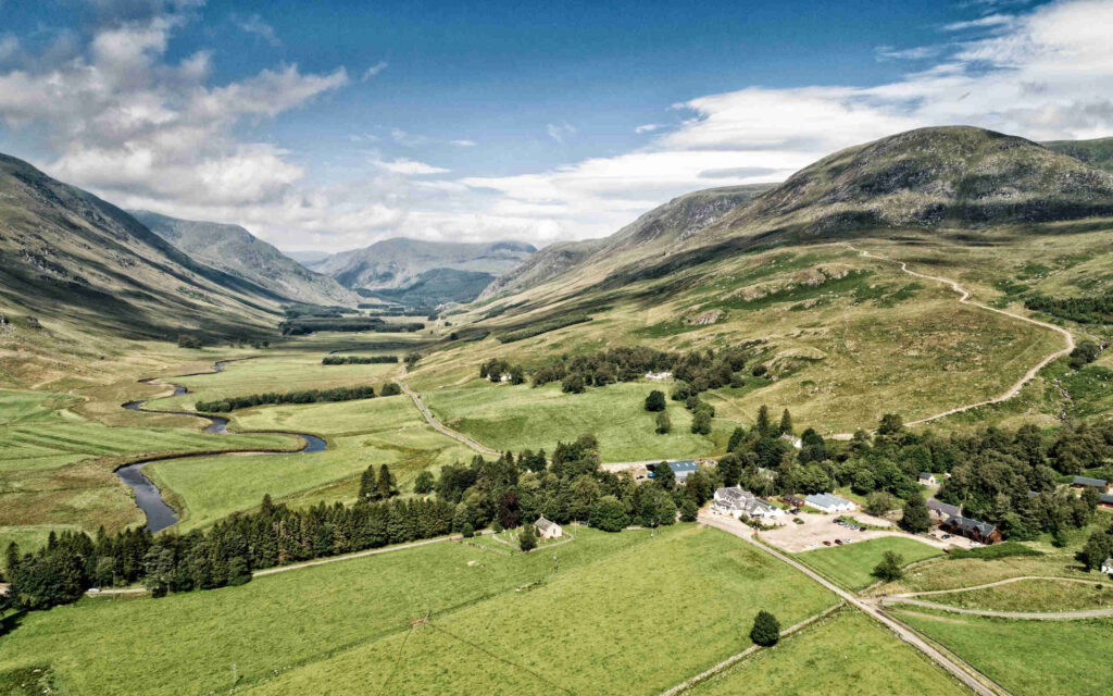 Aerial view of Glen Clova Hotel and Lodges from a distance