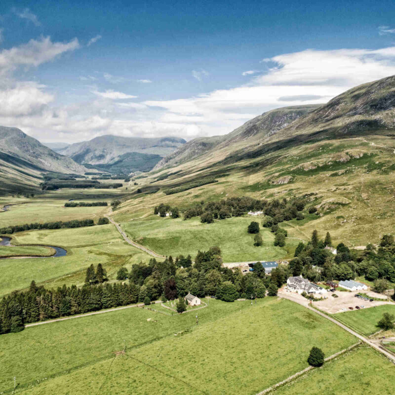 Aerial view of Glen Clova Hotel and Lodges from a distance