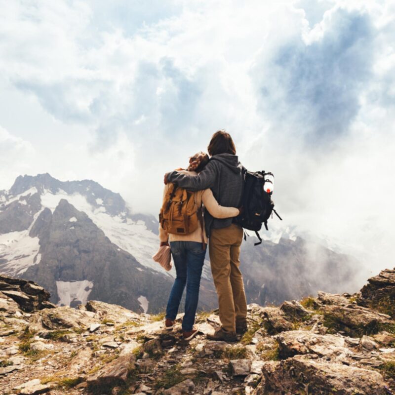 Couples hiking in the Cairngorms National Park at the summit.