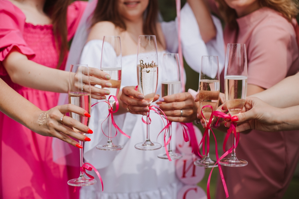 bridal party, bachelorette party, champagne glasses in women's hands