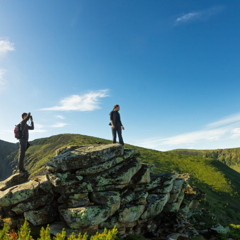 A couple hiking in Spring in the Scottish Highalnds.