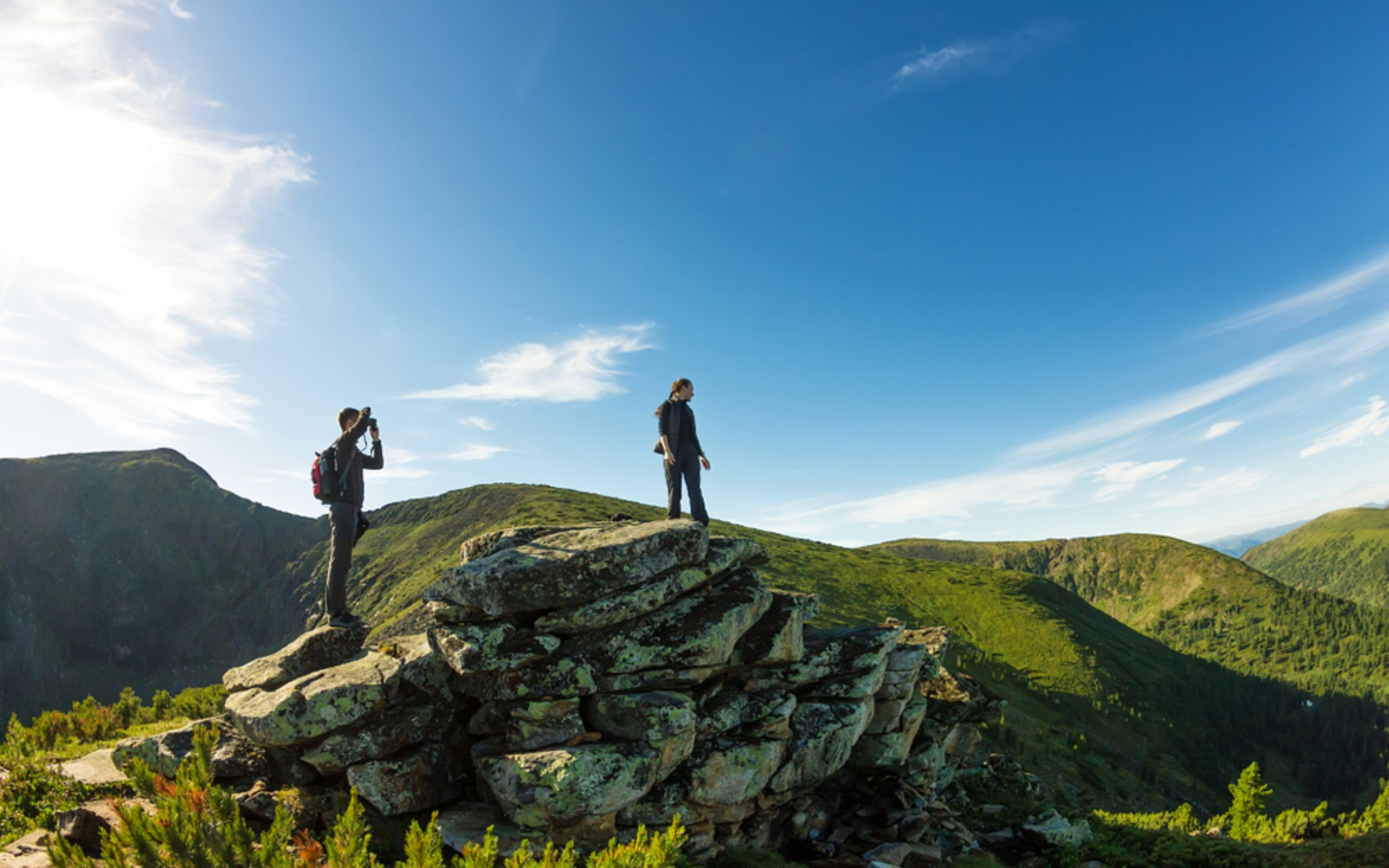 A couple hiking in Spring in the Scottish Highalnds.