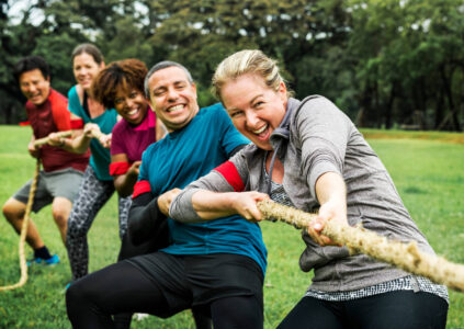 Group taking part in a tug-o-War team-building activity