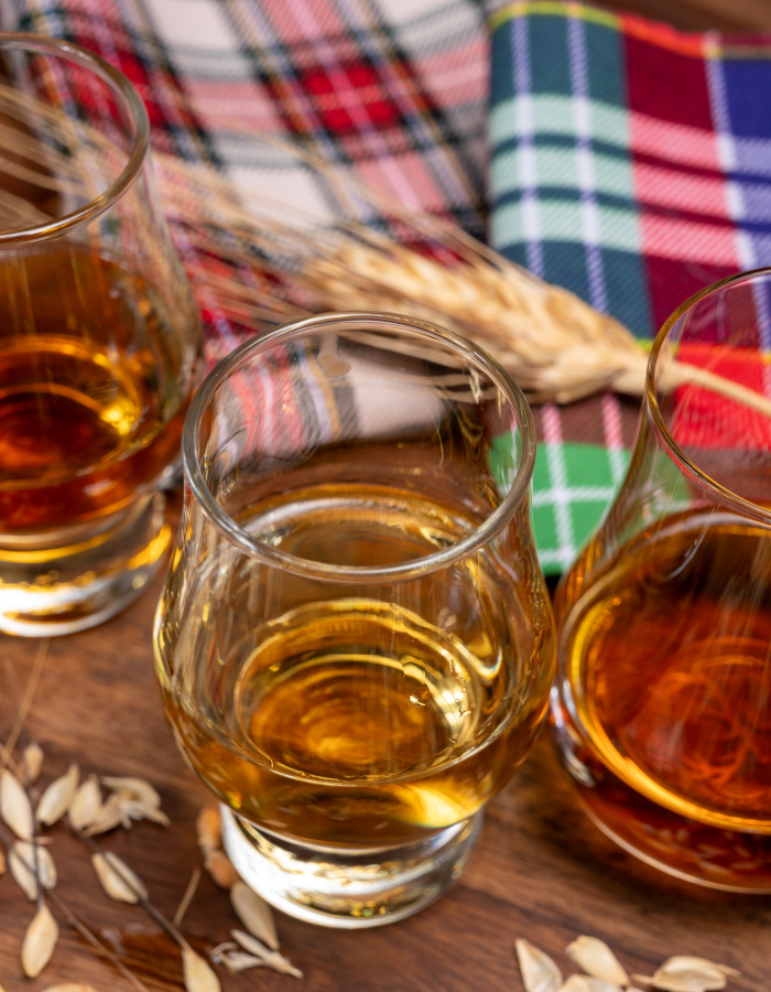 Whisky samples on tartan rug