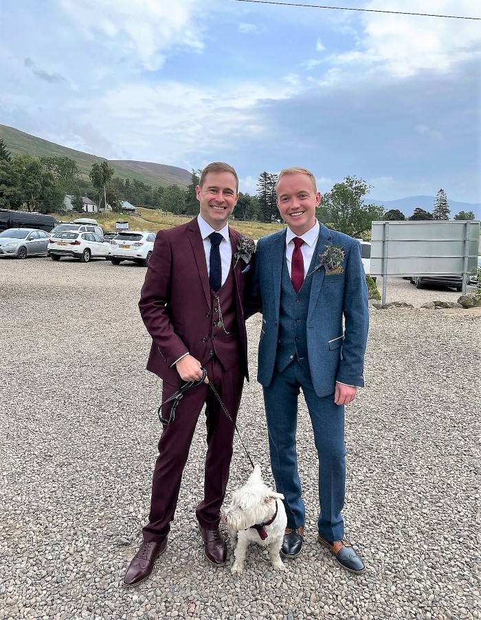 Two grooms away to get married with their Westie dog