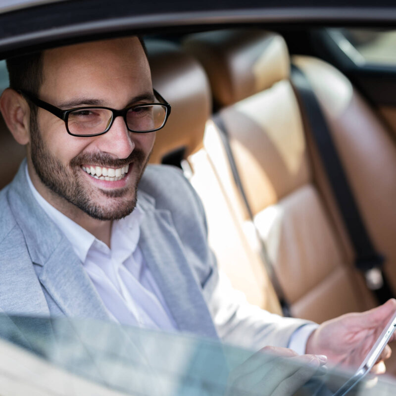 Business traveller in a taxi