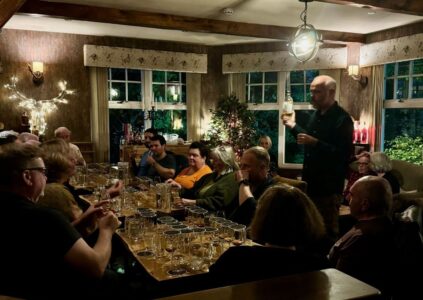 Man hosting a whisky tasting in the Brandy Bothy