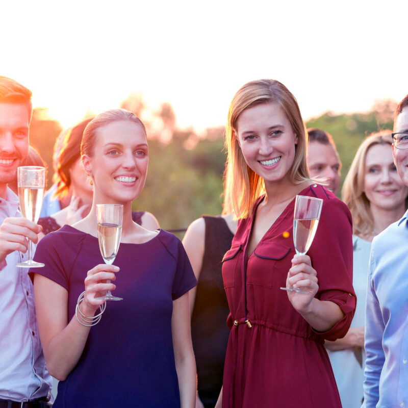 Colleagues drinking fizz at a business event